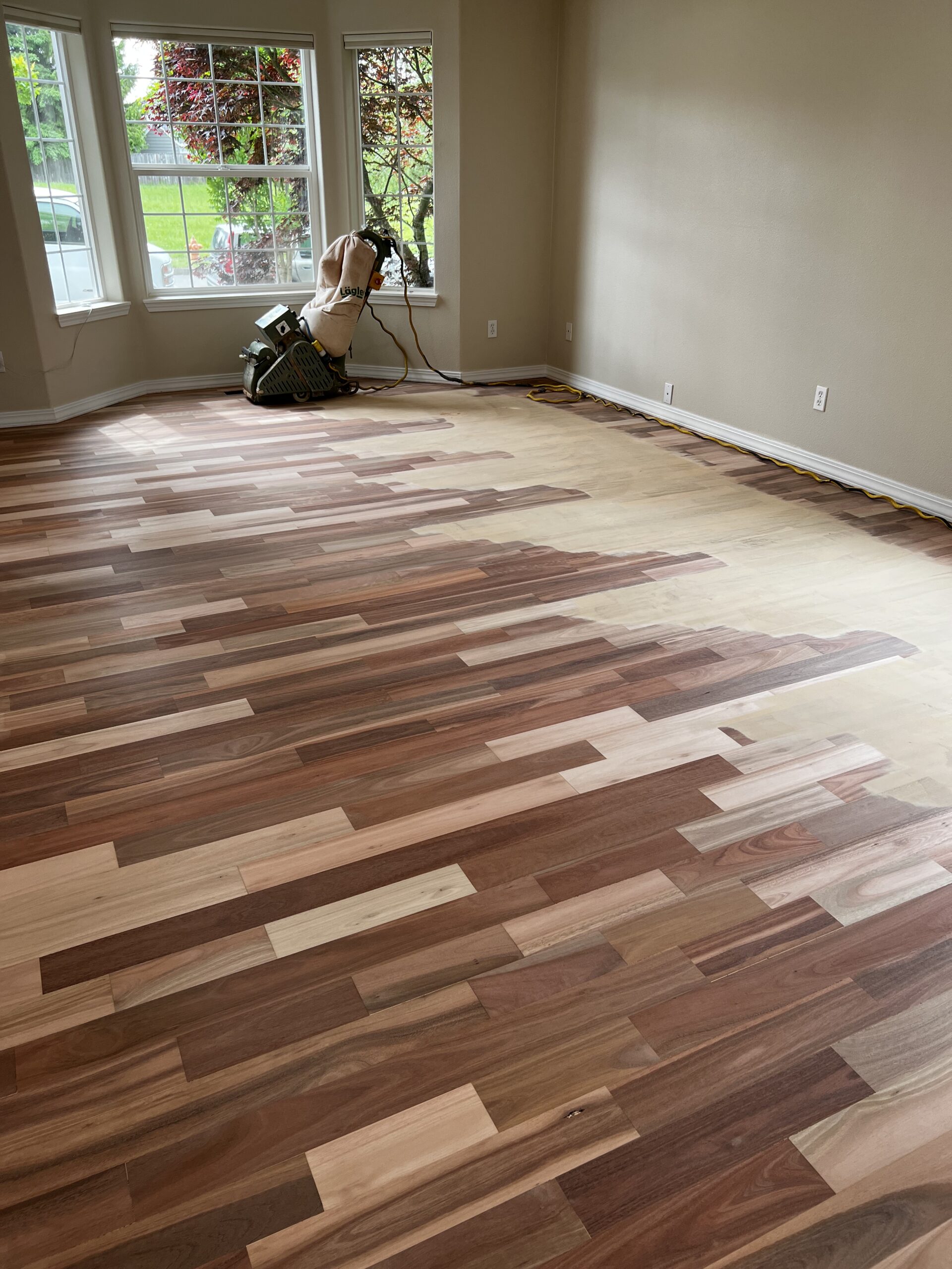 Treadline crew drying a hardwood floor in place with specialized equipment
