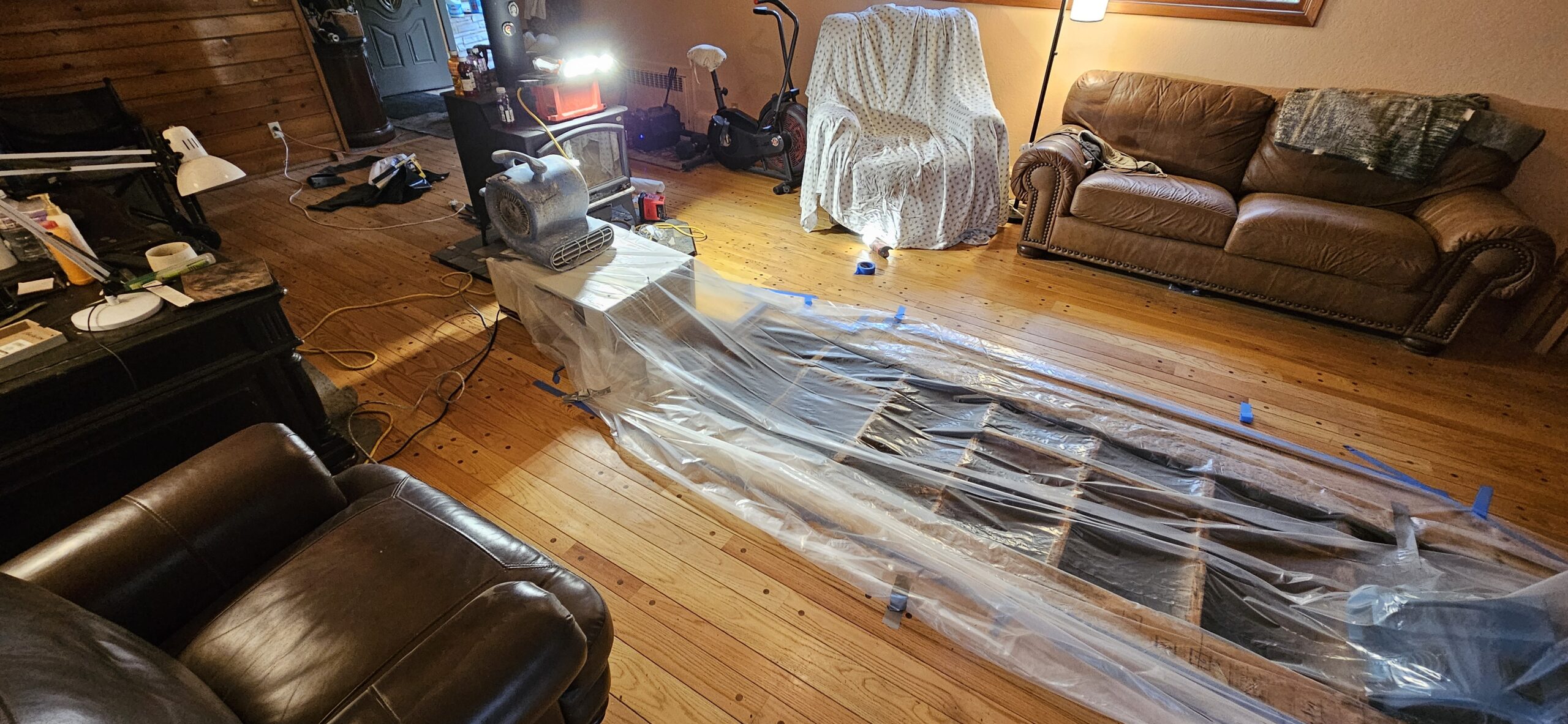 Water damaged hardwood floor showing cupping from an interior leak