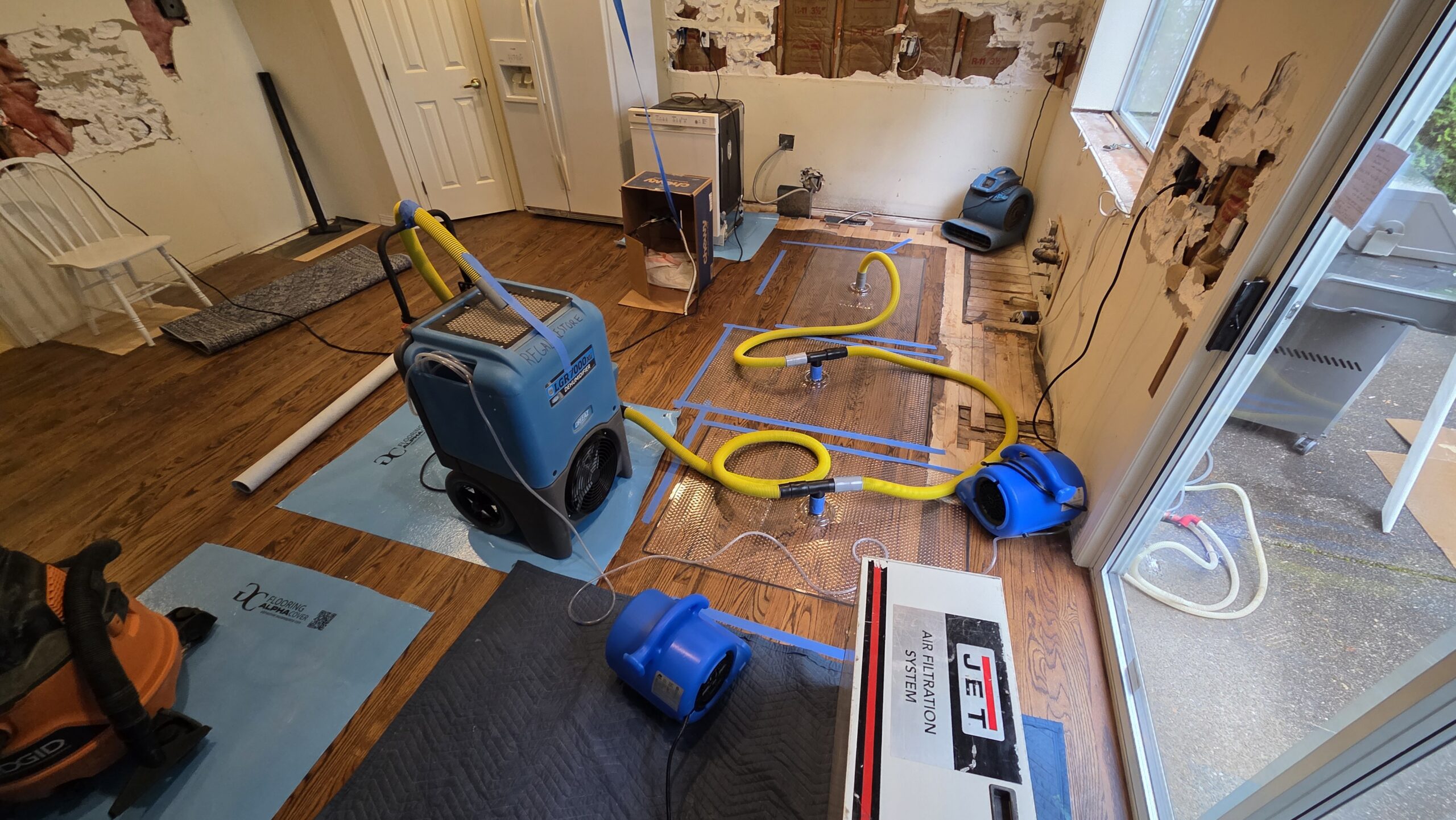 Reconstruction in progress with trim and drywall being reinstalled